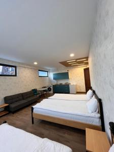Postel nebo postele na pokoji v ubytování Apart-Hotel Seti
