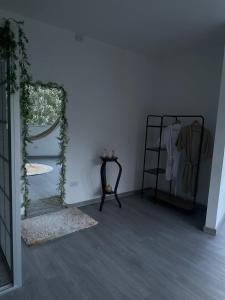 a room with a mirror and a chair and a table at La Terraza,Ciudad Bolivar in Ciudad Bolívar