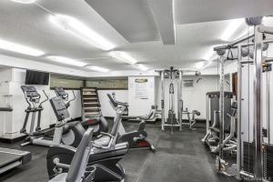 a gym with several treadmills and elliptical machines at Magnificent Mana Studio at Hawaiian Monarch in Honolulu