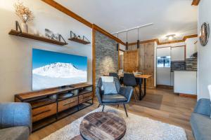 Posezení v ubytování Appartement 4-5 personnes skis aux pieds piscine intérieure sauna hammam