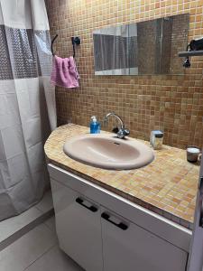 a bathroom with a sink and a shower at Escapade à Fes in Fès +2 photos