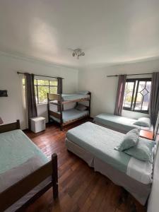 Postel nebo postele na pokoji v ubytování Hostal Valle Norte