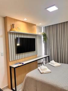 Μια τηλεόραση ή/και κέντρο ψυχαγωγίας στο Brezze Residence pé na areia