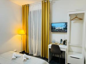 TV a/nebo společenská místnost v ubytování B&B Porta Aperta