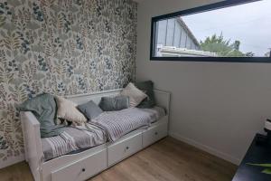 Ένα ή περισσότερα κρεβάτια σε δωμάτιο στο Jupiter Tiny House