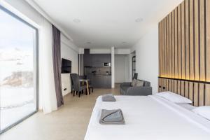 Postel nebo postele na pokoji v ubytování New Gudauri View Hotel