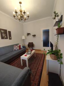 a living room with a couch and a table at Pepper House Edessa in Edessa