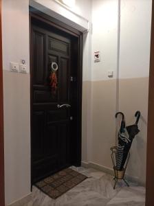 a black door in the hallway of a house at Pepper House Edessa in Edessa