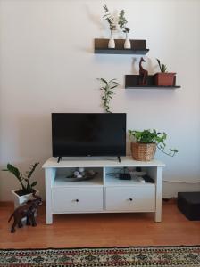 a white entertainment center with a flat screen tv on it at Pepper House Edessa in Edessa