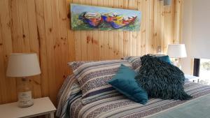 Postel nebo postele na pokoji v ubytování Cabaña Zapallar interior