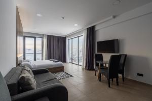 Postel nebo postele na pokoji v ubytování New Gudauri View Hotel