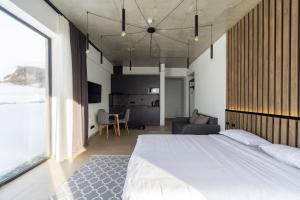 Postel nebo postele na pokoji v ubytování New Gudauri View Hotel