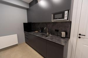 Kuchyň nebo kuchyňský kout v ubytování New Gudauri View Hotel