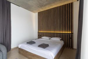 Postel nebo postele na pokoji v ubytování New Gudauri View Hotel