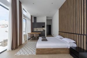 Postel nebo postele na pokoji v ubytování New Gudauri View Hotel