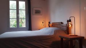 Postel nebo postele na pokoji v ubytování Maison de charme près plage