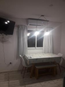 a room with a bed in a room with a window at Sierra Bonita - Viví en Armonía in Sierra de los Padres