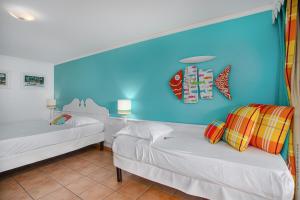 Lova arba lovos apgyvendinimo įstaigoje Studio Premium vue Mer et Piscine, résidence de vacances