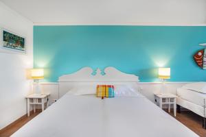 Lova arba lovos apgyvendinimo įstaigoje Studio Premium vue Mer et Piscine, résidence de vacances