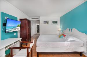 Lova arba lovos apgyvendinimo įstaigoje Studio Premium vue Mer et Piscine, résidence de vacances