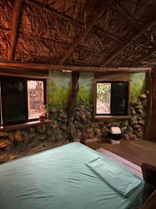 Una cama o camas en una habitación de Cahuita Vibe