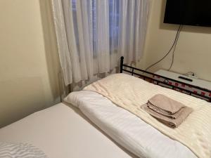 Postel nebo postele na pokoji v ubytování HS Hotel