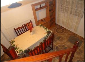 a dining room with a table and some chairs at Duplex a 5 cuadras del mar con WiFi y TV Calle 36 y 6 in Santa Teresita +1 photo