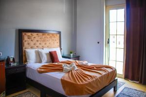 Voodi või voodid majutusasutuse Cairo Paradise Hotel toas