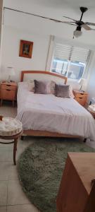 a bedroom with a large bed and a window at apartmento punta del este playa mansa in Punta del Este