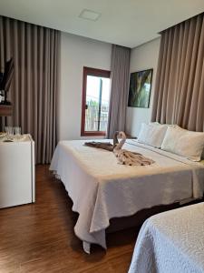 Voodi või voodid majutusasutuse Max Suíte toas