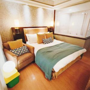 Postel nebo postele na pokoji v ubytování Deja Vu Hotel