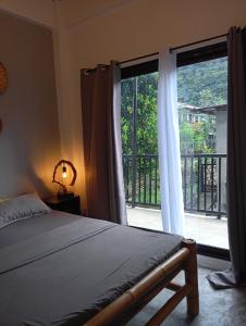 Postel nebo postele na pokoji v ubytování Tsada Balay Homestay