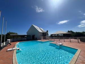 a large swimming pool on top of a building at Studio de charme au Gosier in Le Gosier