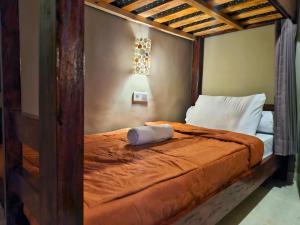 Postel nebo postele na pokoji v ubytování Tude Hostel Ubud