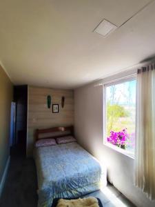 Ένα ή περισσότερα κρεβάτια σε δωμάτιο στο Ecológic house Dunas da Imara , Casa 2 dormitórios próximo ao mar