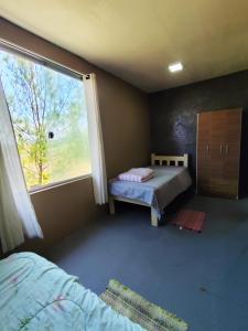 Ένα ή περισσότερα κρεβάτια σε δωμάτιο στο Ecológic house Dunas da Imara , Casa 2 dormitórios próximo ao mar +19 φωτογραφίες