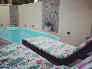 a swimming pool with a mattress next to a tub at San Rafael Group in San Rafael