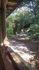 a view of a table and chairs from a window at Remanso del Citon in Salsipuedes