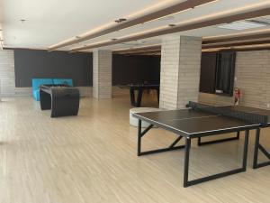 a room with a ping pong table and ping pong balls at Muro Alto Resort in Porto De Galinhas