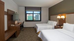 a hotel room with two beds and a window at Holiday Inn Express Mexico Santa Fe by IHG in Mexico City +57 photos
