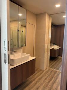 a bathroom with a white sink and a mirror at A303Forestkhaoyai in Ban Huai Sok Noi +7 photos