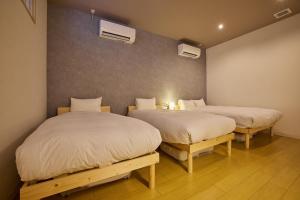 Postel nebo postele na pokoji v ubytování 河口湖 stay ZURA