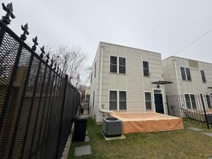 a building with a tent in front of it at Beautiful Cozy Home in DC with Easy Parking in Washington