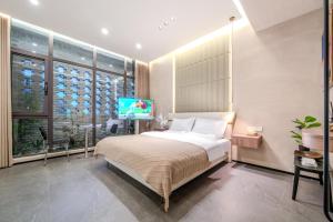 Xiyou Hotel Xi'an City Wall Branch禧又HOTEL客房内的一张或多张床位