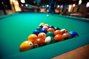 a group of billiard balls on a pool table at Hotel Pousada Villas do Atlântico in Lauro de Freitas