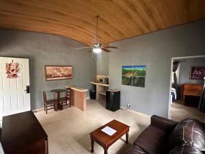 a living room with a couch and a table at Hostal Lopez El Valle Cabañas in El Valle