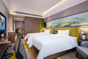 TV a/nebo společenská místnost v ubytování Hampton by Hilton Zhangjiajie Tianmen Mountain
