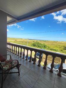 a balcony with a view of the ocean at Sobrado a Beira Mar in Rio Grande