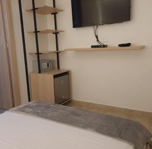 Cama ou camas em um quarto em Santa Julia Alojamiento