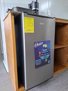 a refrigerator with a sticker on the side of it at Yin Garden Lodge Fortuna in Fortuna